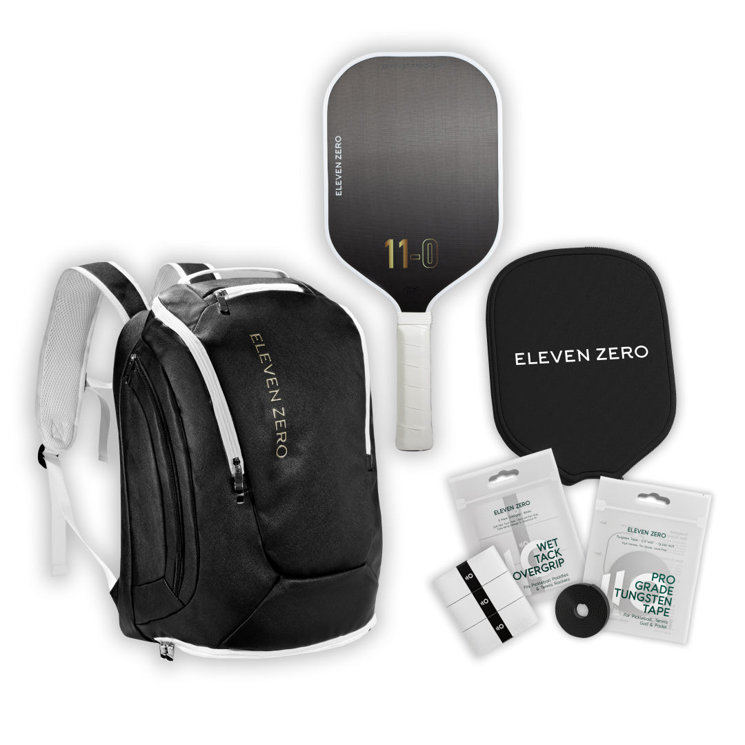 Black Eleven Zero pickleball backpack with carbon paddle, paddle cover, wet tack overgrip pack, and pro-grade tungsten tape.