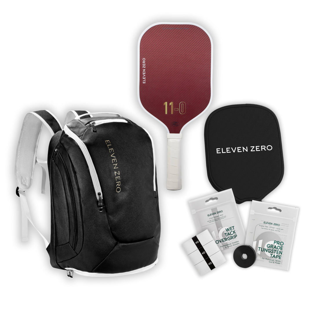 Black Eleven Zero backpack paired with a Kevlar pickleball paddle, paddle cover, overgrips, and tungsten tape.