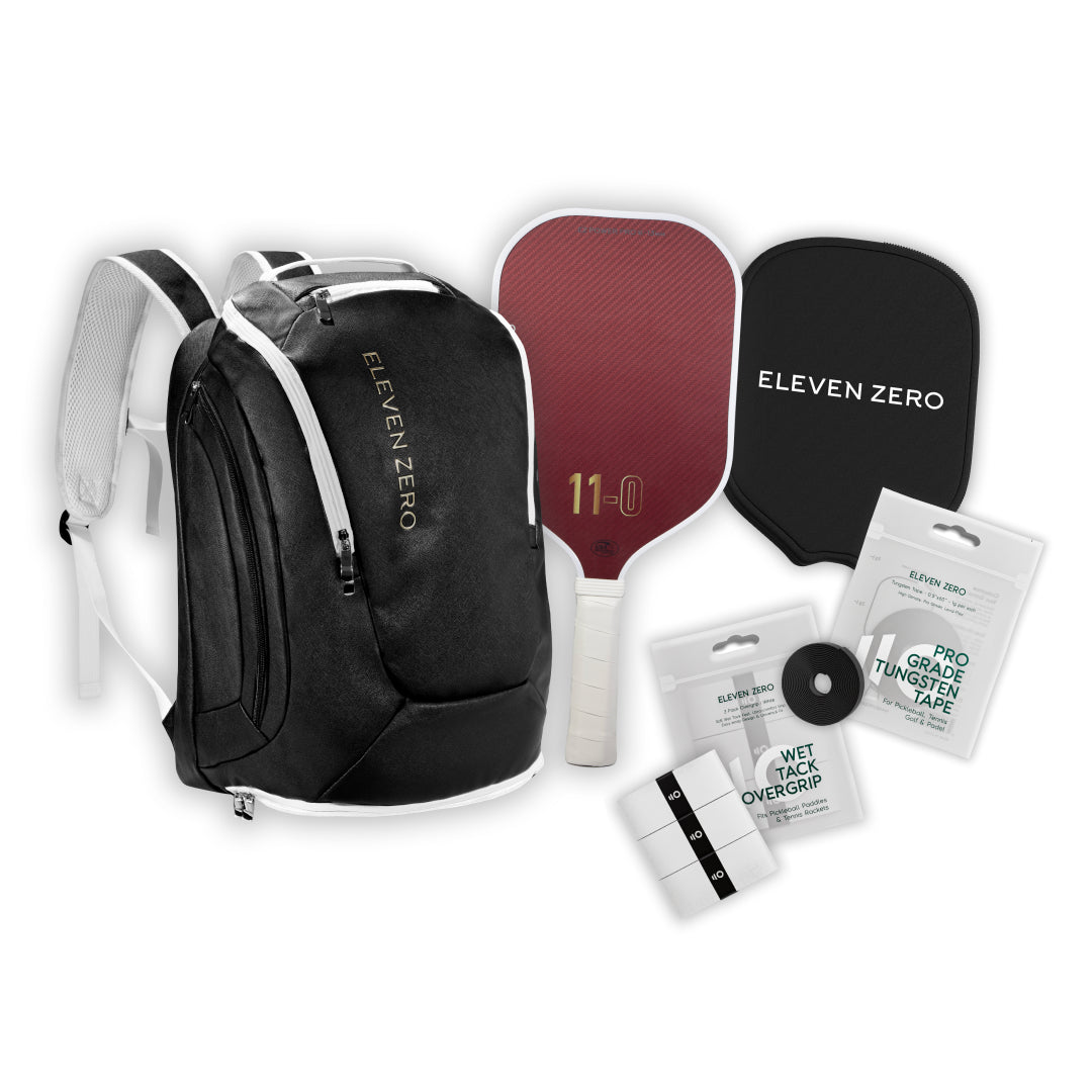 Complete Eleven Zero setup featuring black backpack, Kevlar paddle, paddle cover, overgrip pack, and tungsten tape.