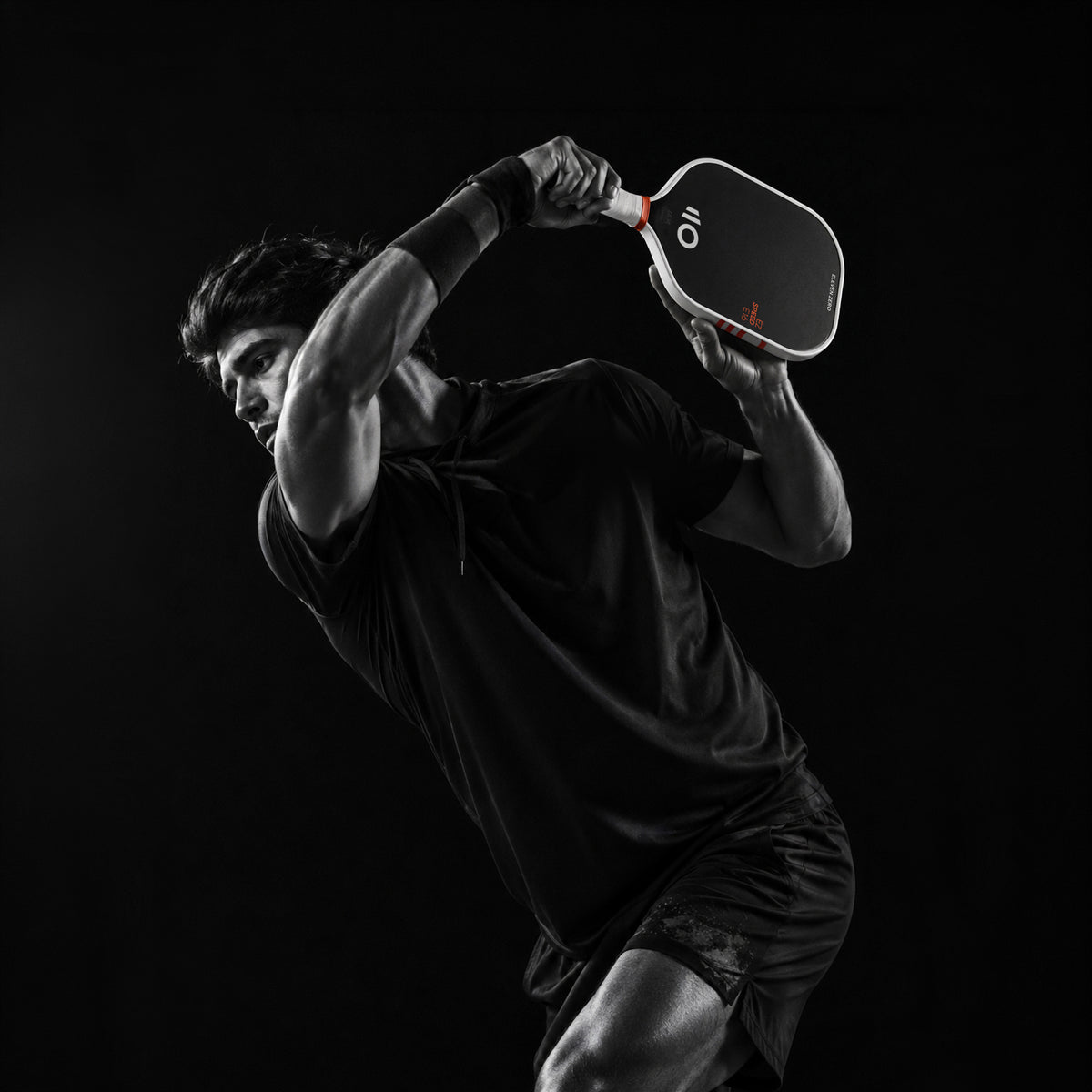 a sportive man is posing with the eleven zero EZ Speed E16 paddle. He is about the hit