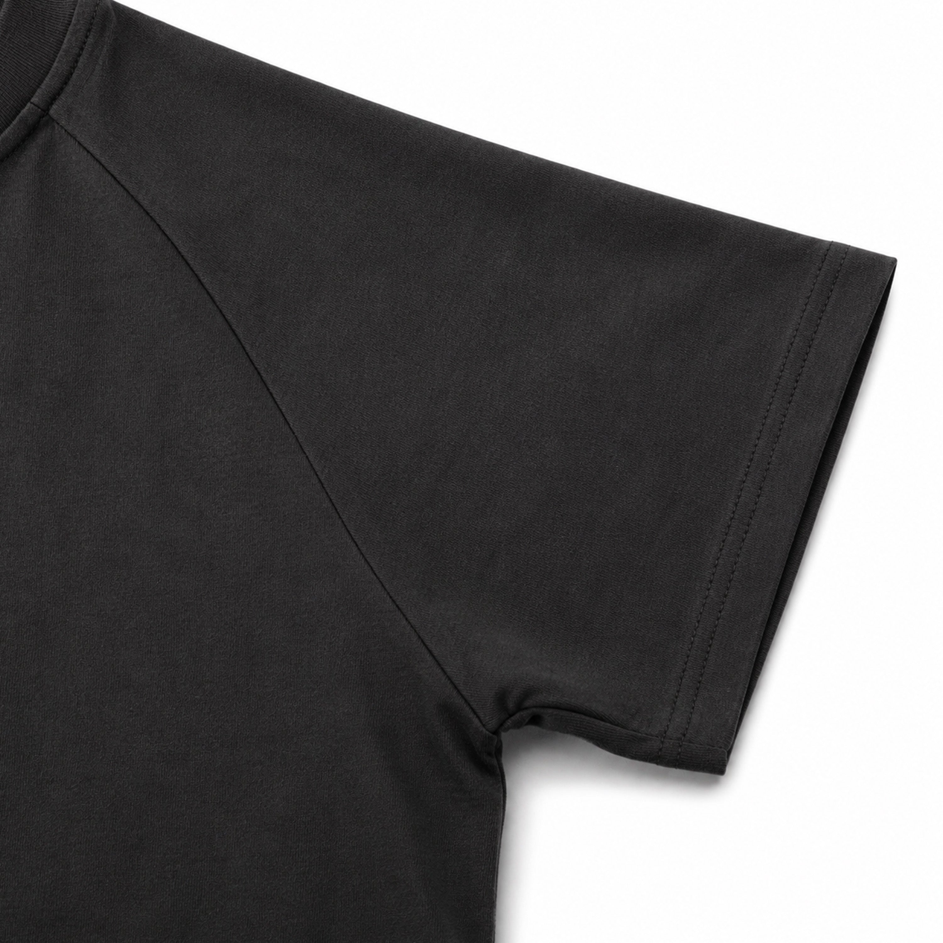 Black t-shirt sleeve on a light gray background
