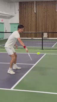 Load video: Side view of a pickleball player using the EZ Power Kevlar paddle to return a fast-paced serve.