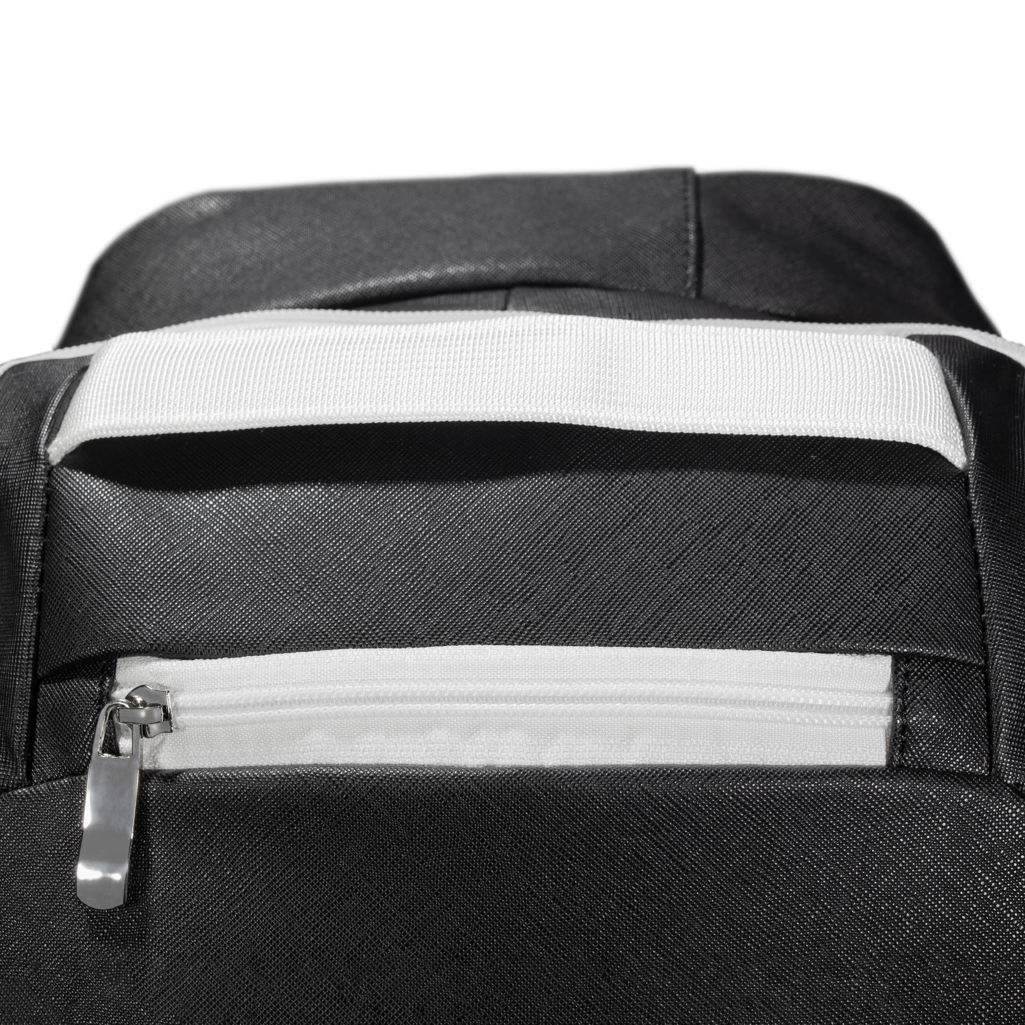 Close-up of black Eleven Zero backpack showing the white top carry handle and zippered pocket with white trim.