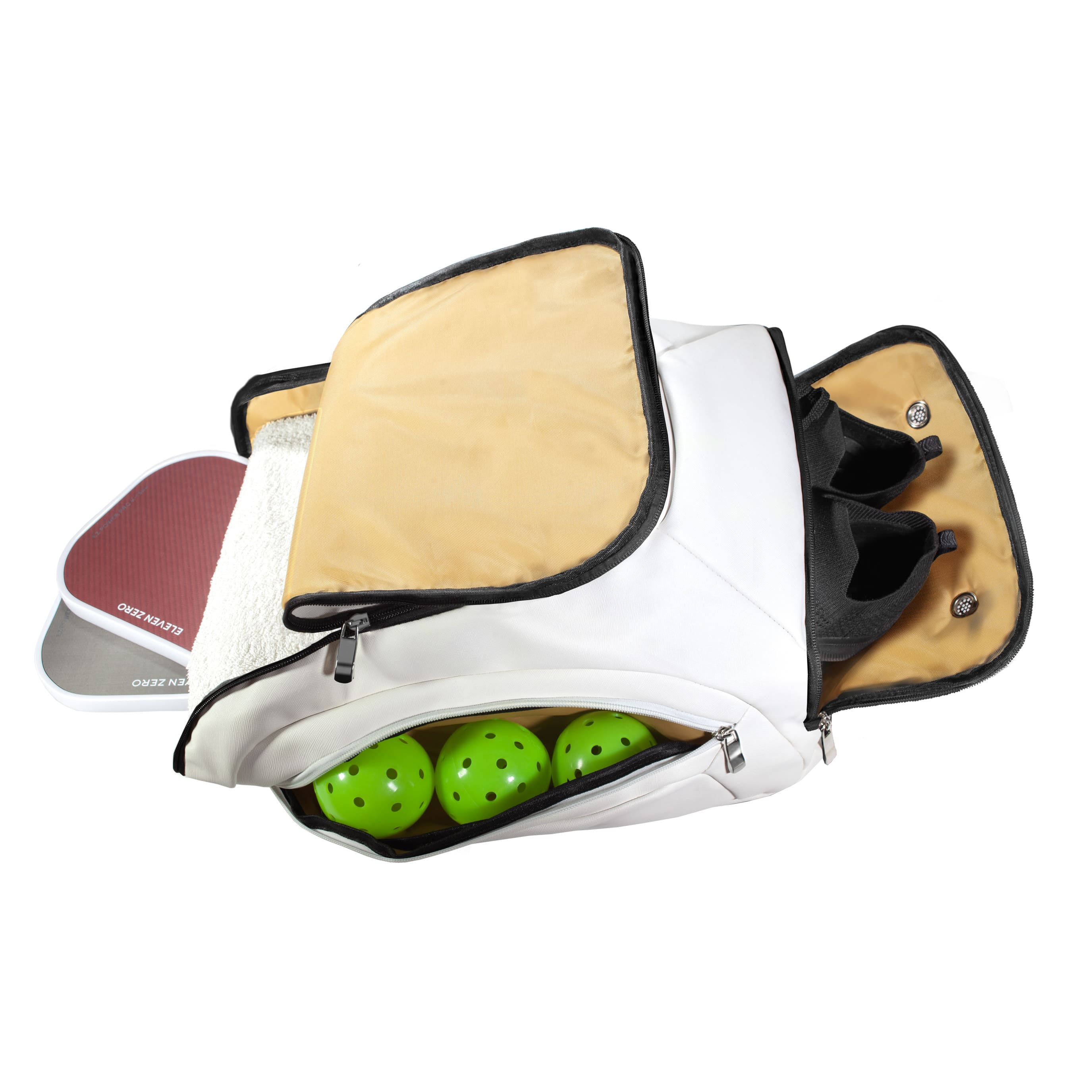 Fully packed Eleven Zero backpack with compartments open, showing paddles, towel, balls, and shoes.