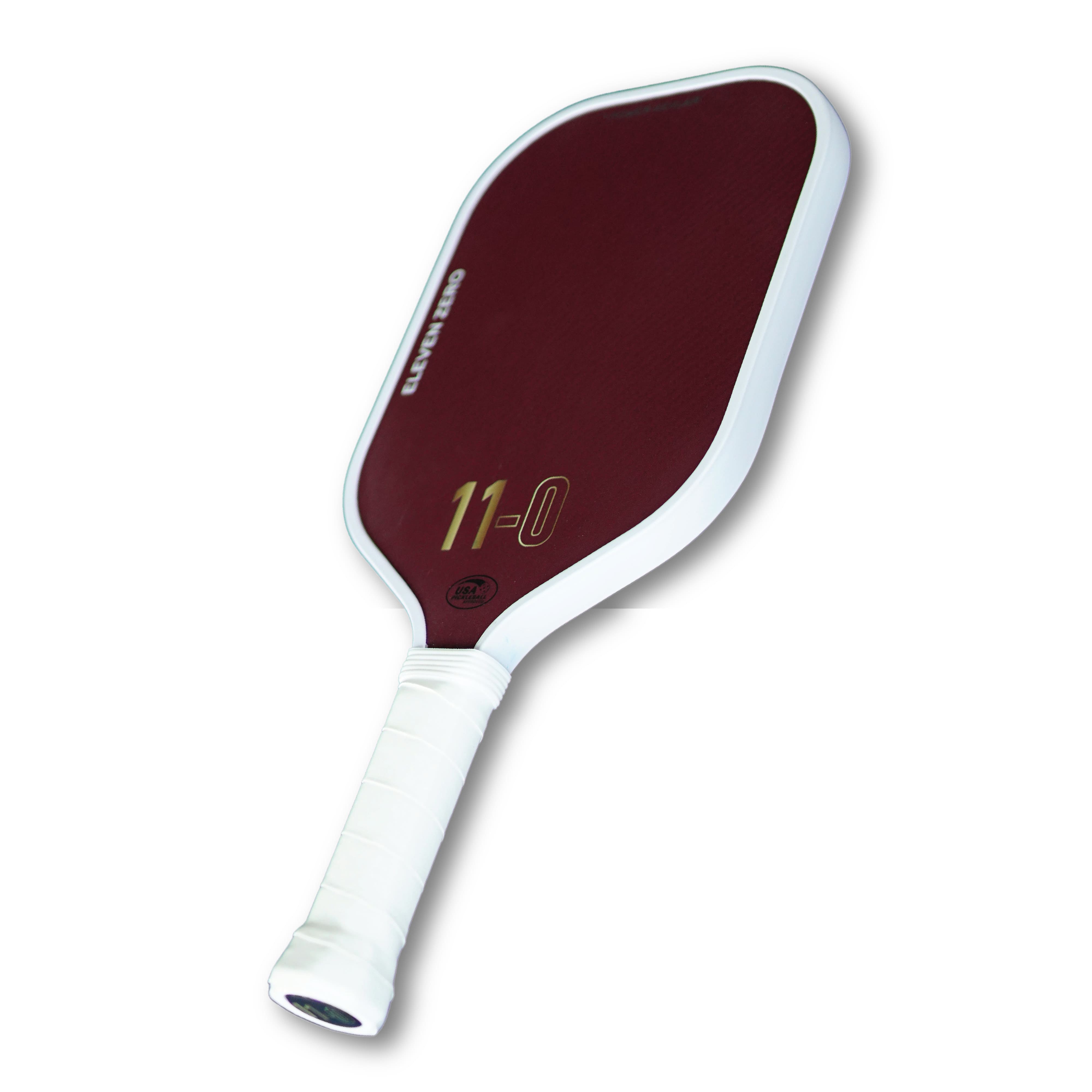 Angled side view of the Eleven Zero K-16 pickleball paddle showing thickness and handle grip