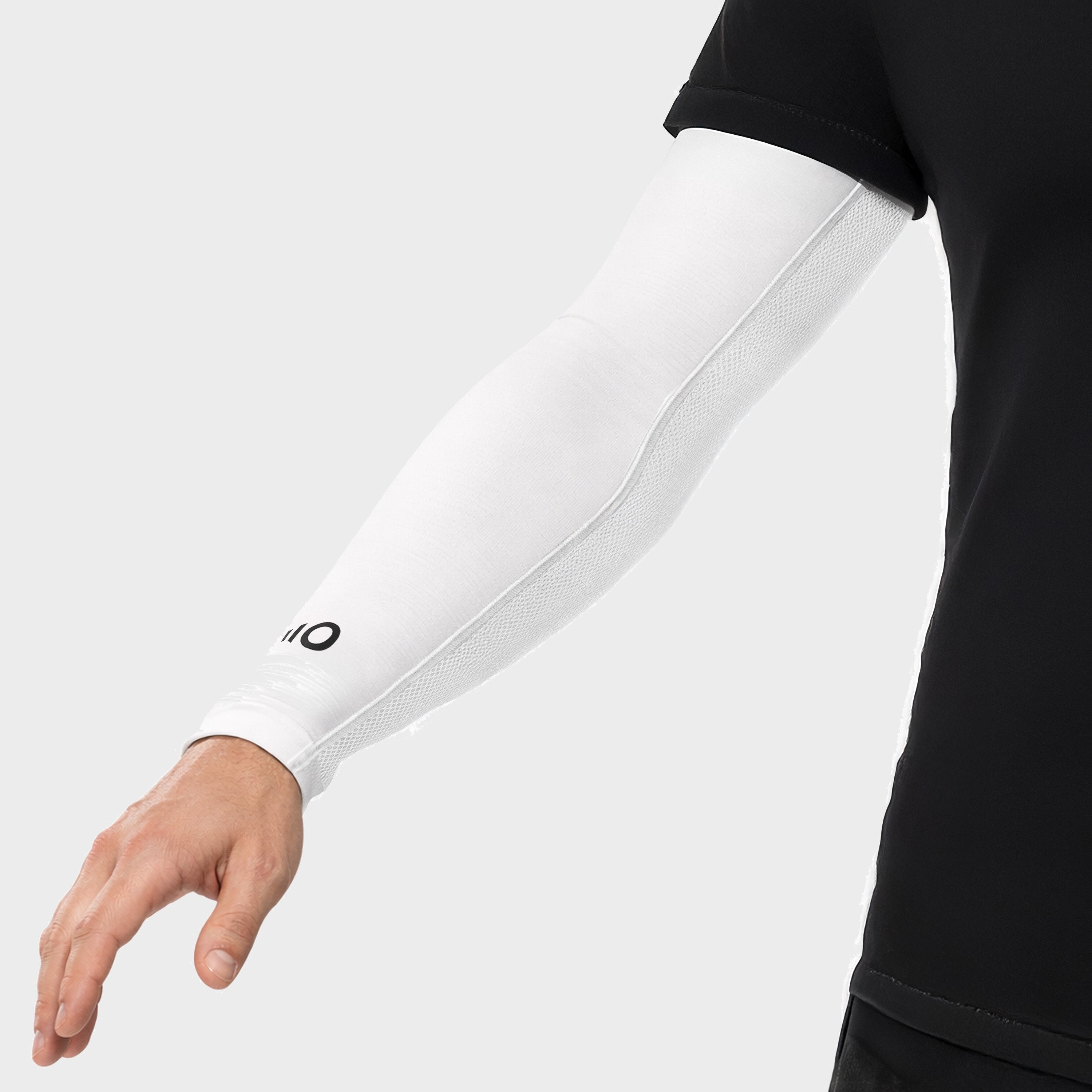 White arm sleeve with a logo on a person wearing a black shirt against a white background