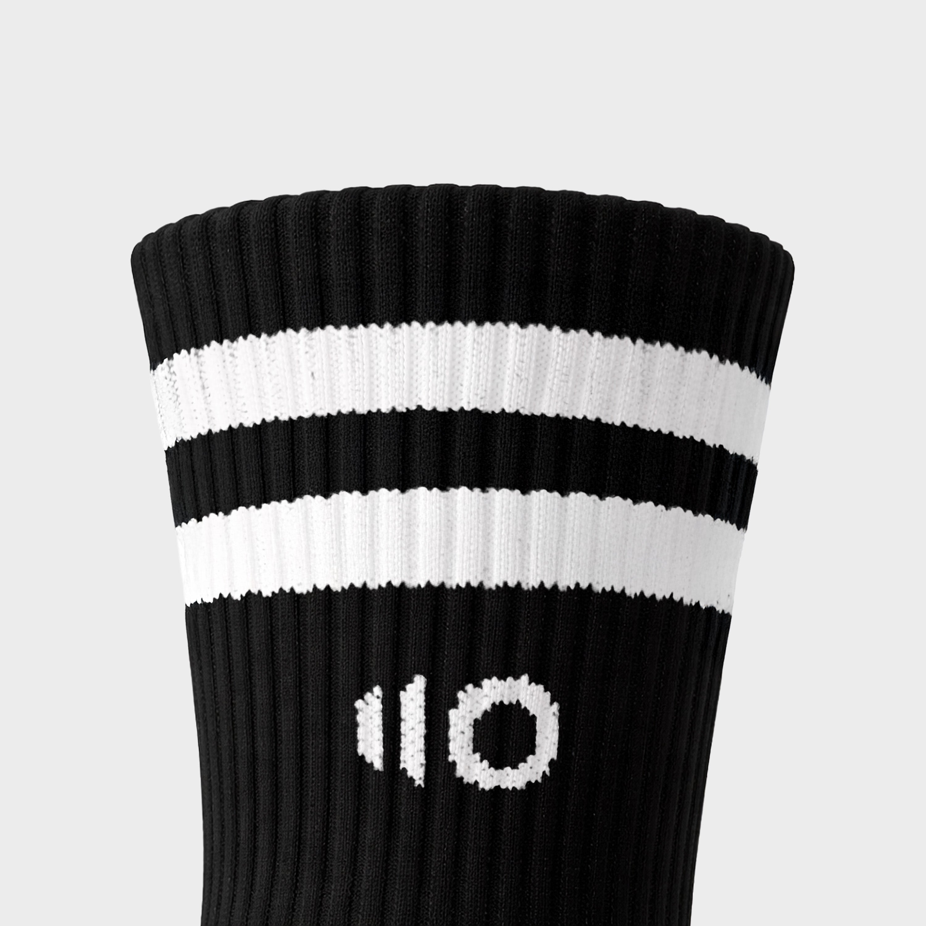 Black and white striped sock with number 10 on a light gray background