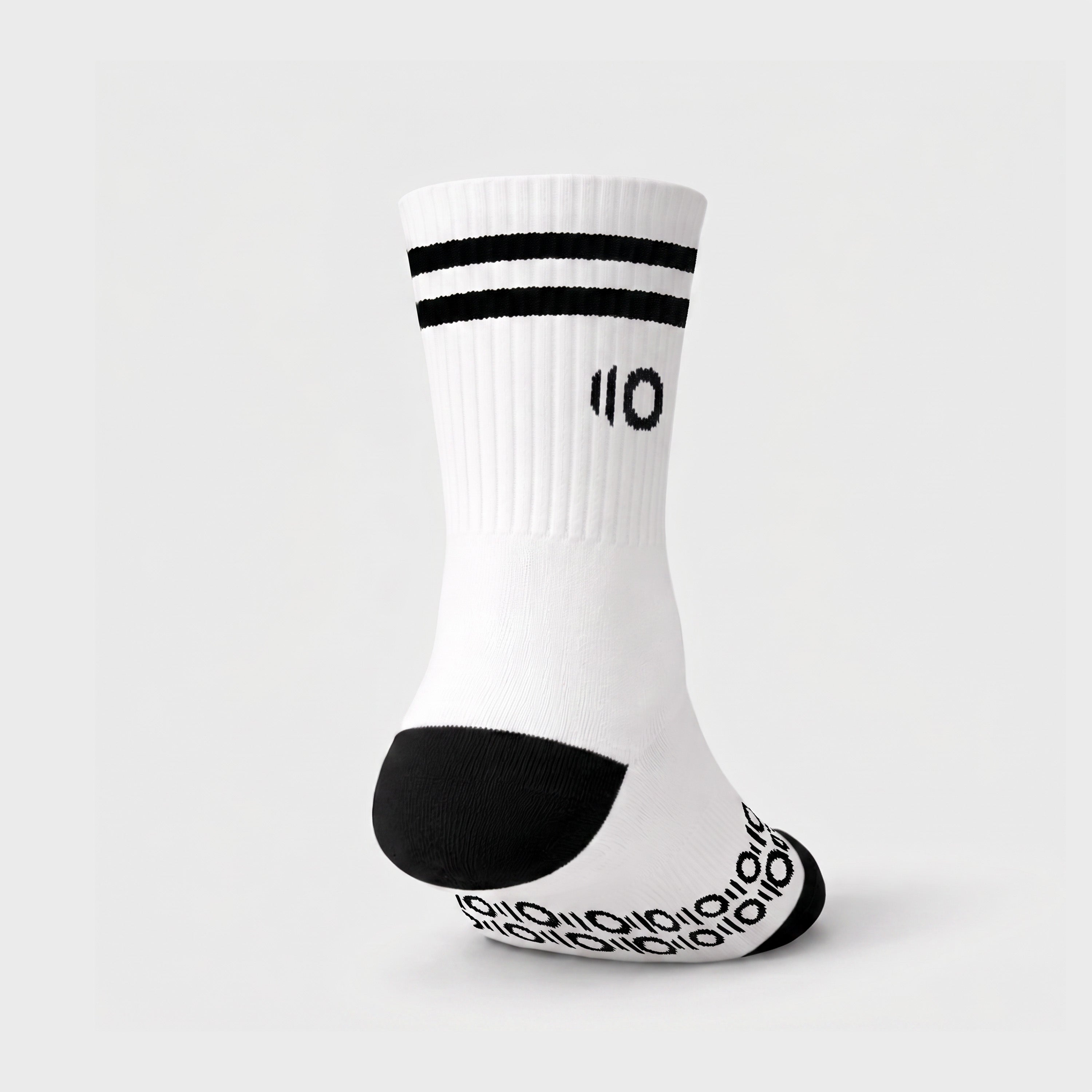 White sock with black accents on a light gray background