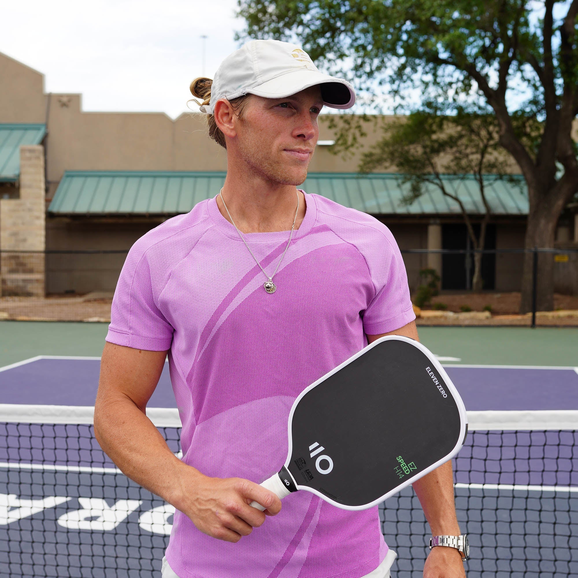 Aleck Blair on court holding an Eleven Zero EZ Speed paddle