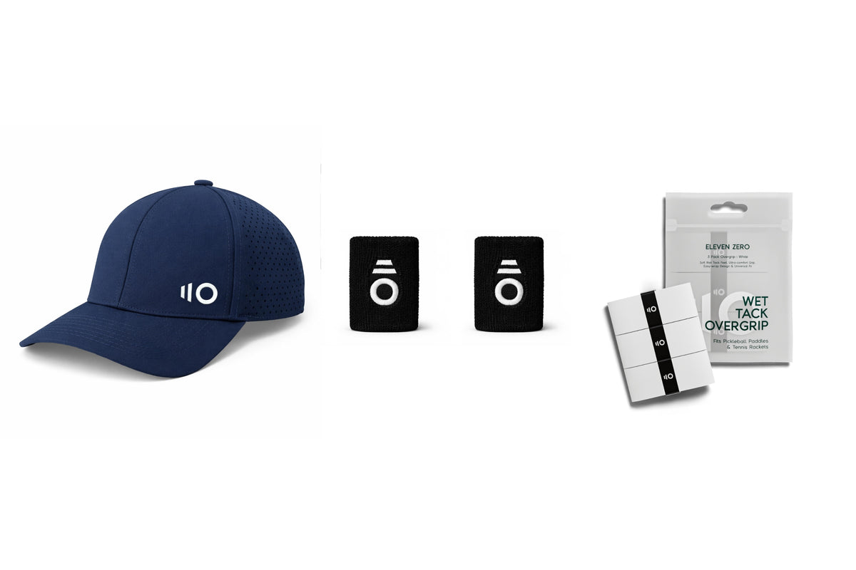Navy performance cap with two black wrist sweatbands and three white overgrips