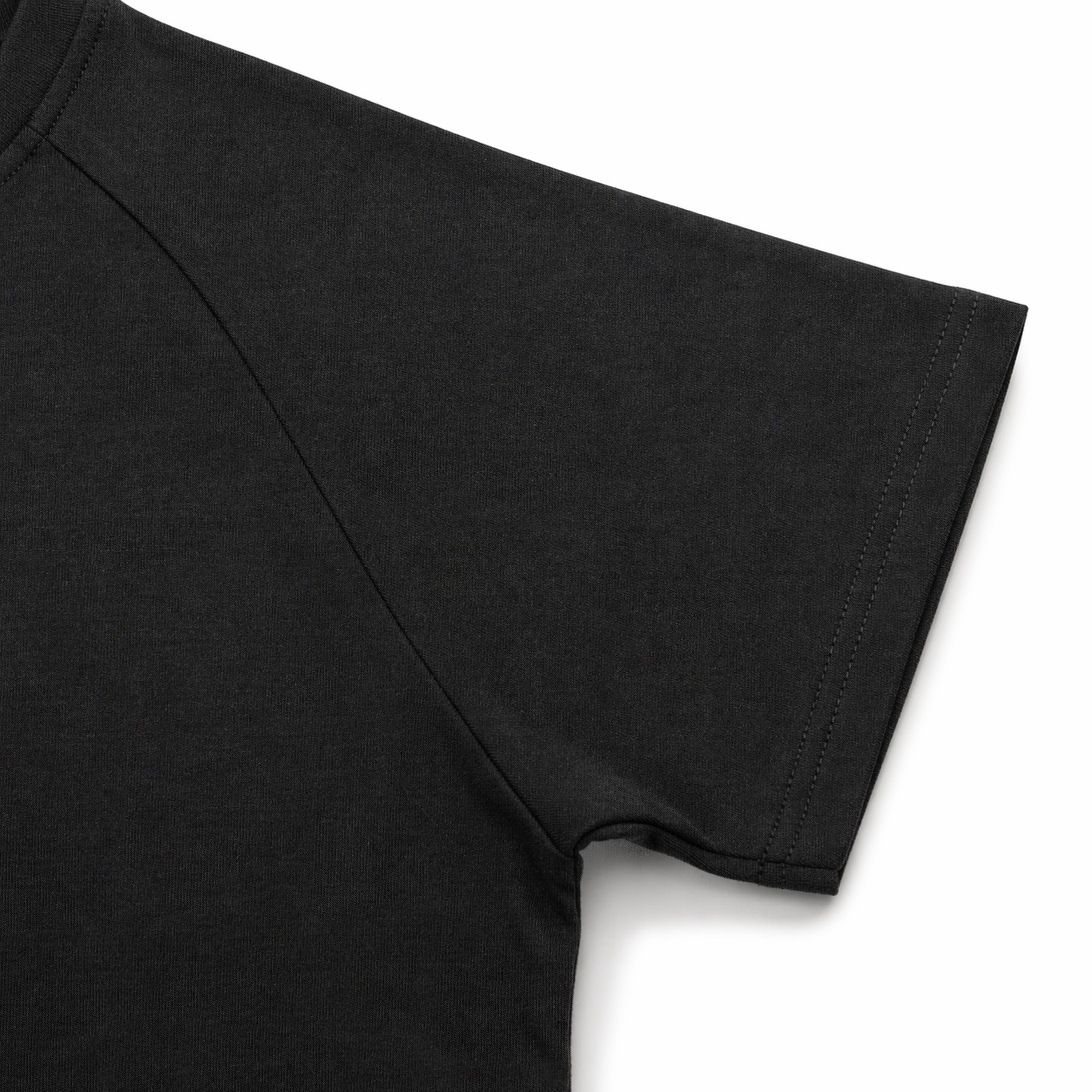 Black t-shirt sleeve on a light gray background