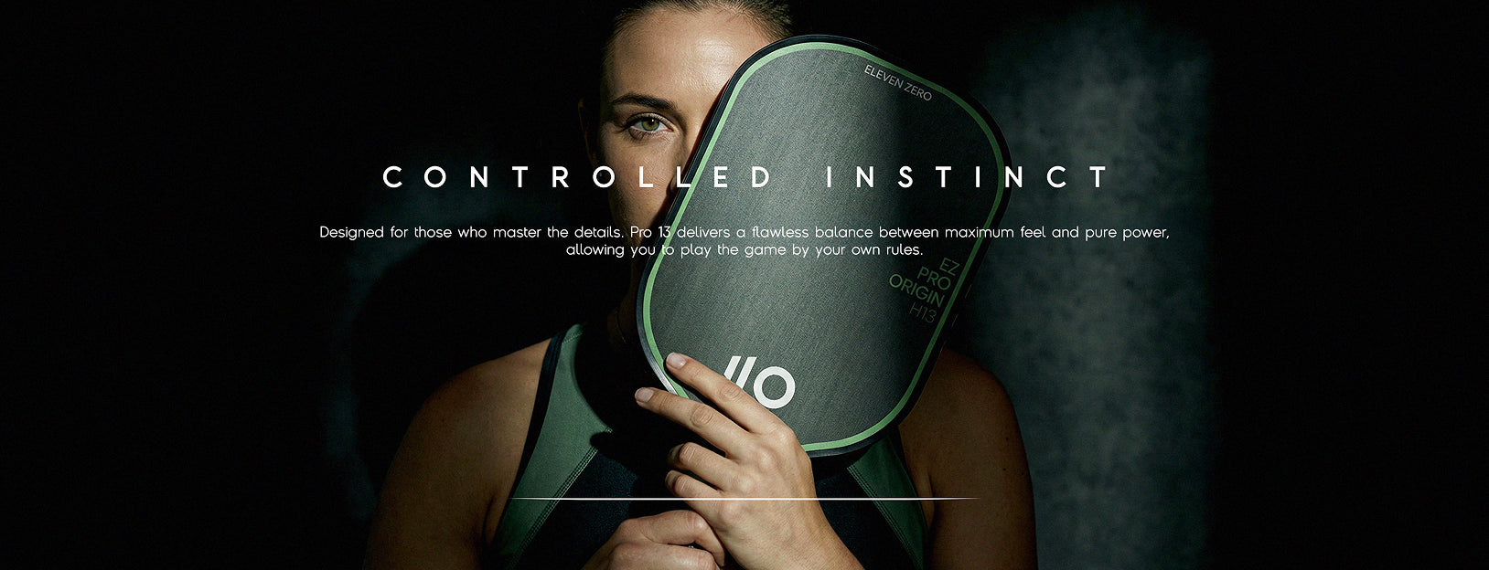 A woman holding the EZ PRO ORIGIN H13 paddle, product reveal image.