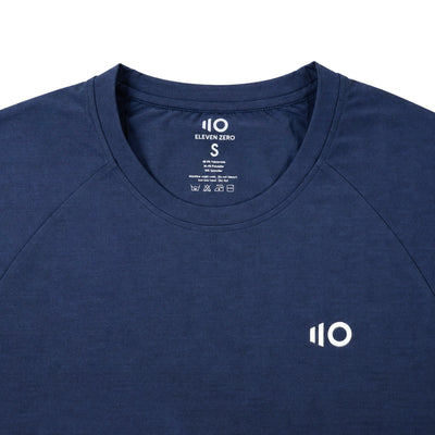 Navy blue t-shirt with 'Eleven Zero' logo on a light gray background