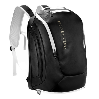 Front angled view of black Eleven Zero backpack with white zippers and gold logo.