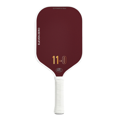 Front view of the Eleven Zero K-16 pickleball paddle in maroon with gold “11-0” logo and white trim
