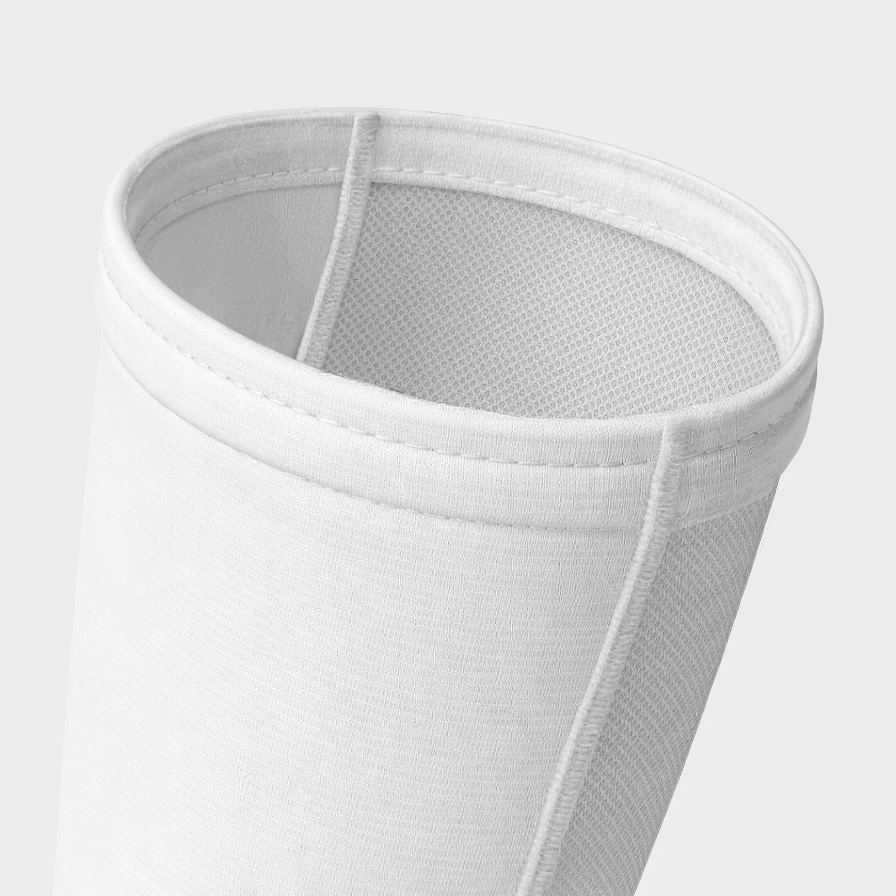 White mesh filter on a light gray background