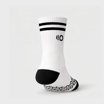 White sock with black accents on a light gray background