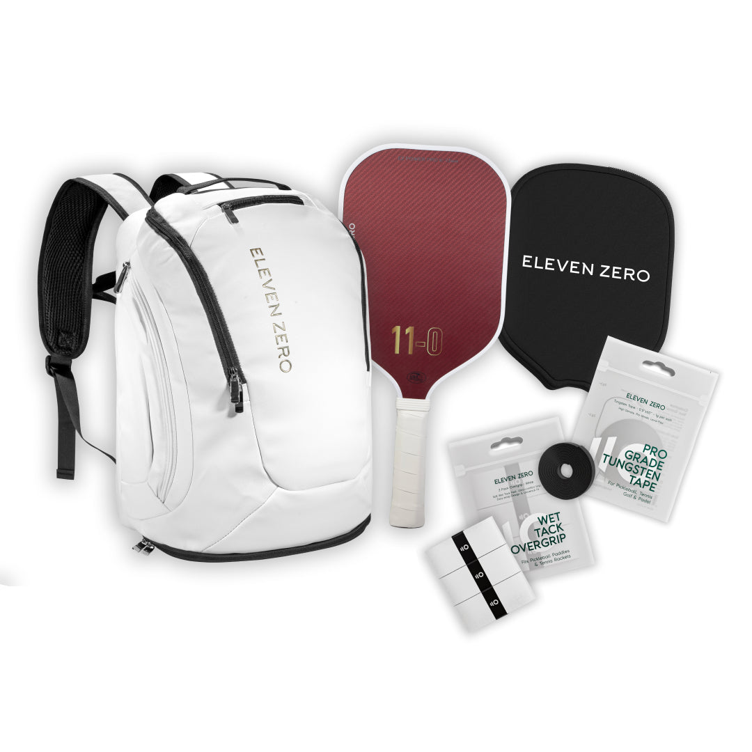 Gear set including white Eleven Zero backpack, Kevlar paddle, protective cover, overgrips, and tungsten tape.